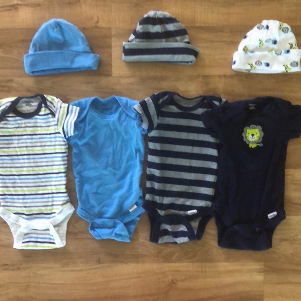 Four pack onesies with hats.